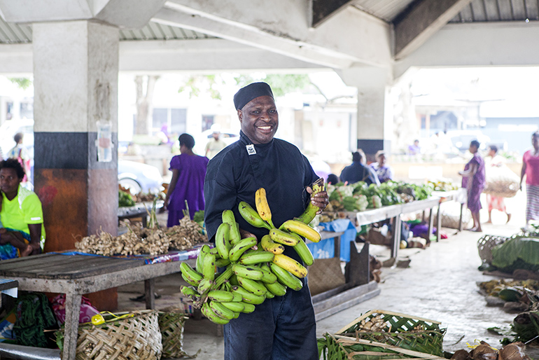 family holiday Vanuatu | Local with bananas